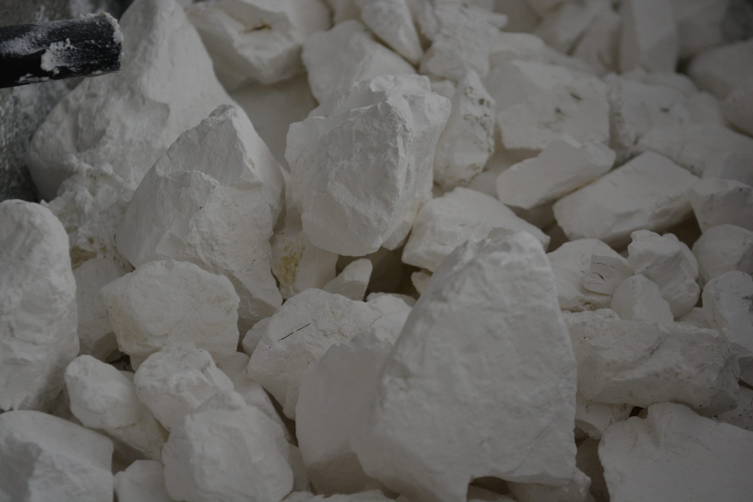 Delegate (2023): close-up of white lumps of quicklime